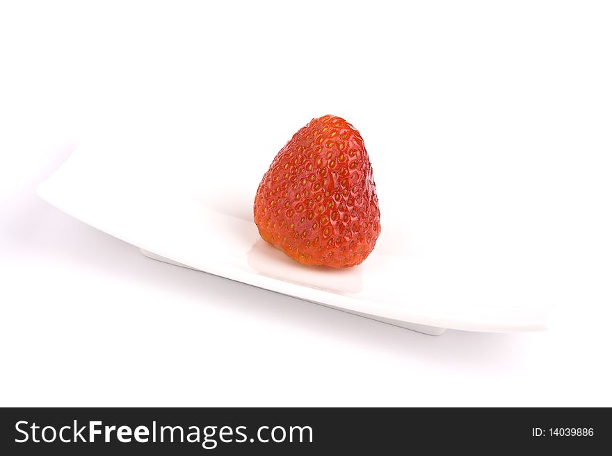 Strawberry on white plate isolated. Strawberry on white plate isolated