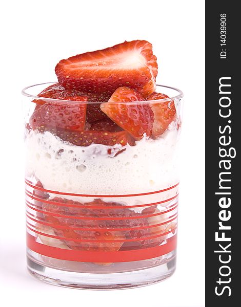 Strawberries with cream in a glass isolated. Strawberries with cream in a glass isolated