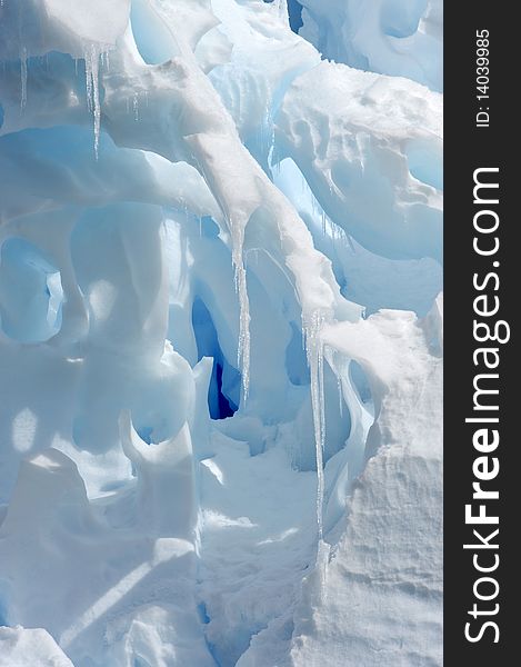 Icicles hanging on a huge iceberg in Antarctica. Icicles hanging on a huge iceberg in Antarctica.