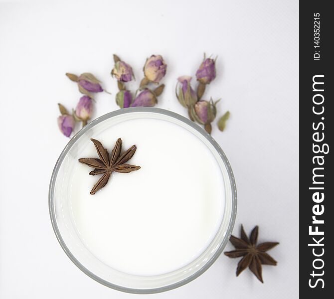 Glass Of Milk, Star Anise And Rose Buds