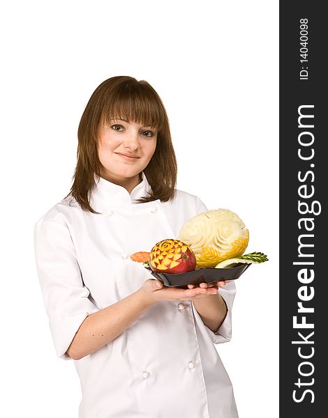 Cook girl holding a plate of fruit isolated on white background