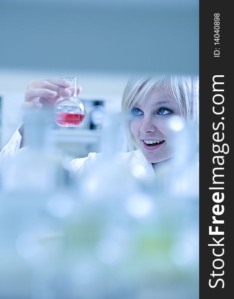 Closeup of a female researcher carrying out experiments in a laboratory