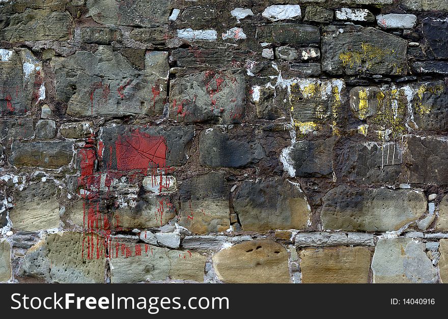 Old stone wall and stained with various colors. Old stone wall and stained with various colors