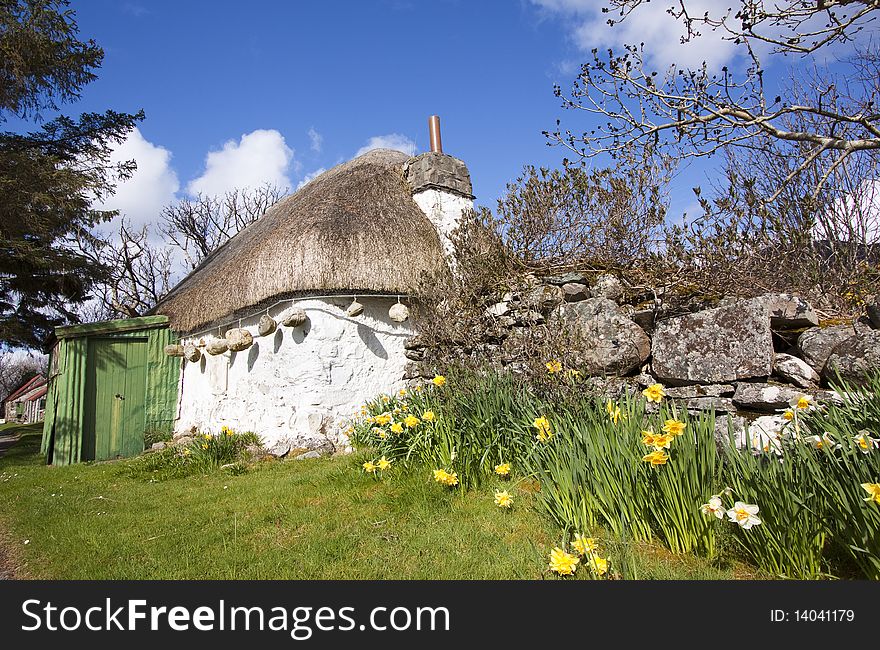 Thatched cottage in Highlands, Scotland. Vibrance increased. Thatched cottage in Highlands, Scotland. Vibrance increased.