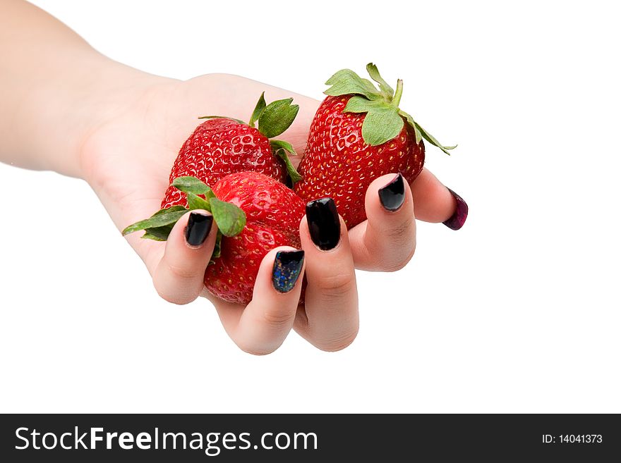 Strawberry in a female hand, it is isolated on a white background