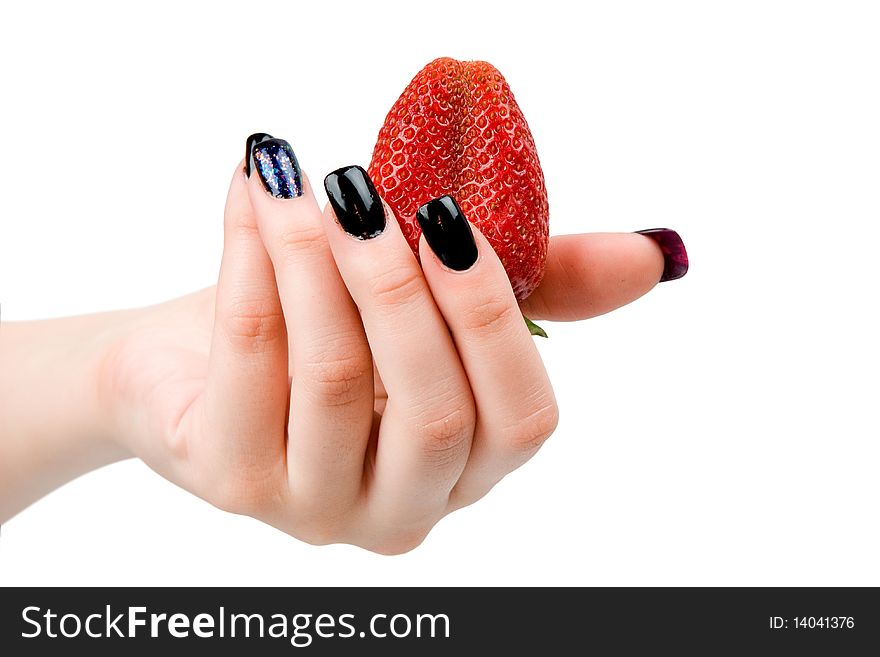 Strawberry in a female hand, it is isolated on a white background