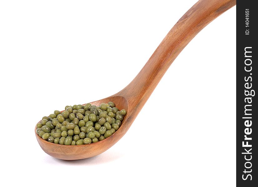 Soybean green wooden spoon on a white background. Soybean green wooden spoon on a white background