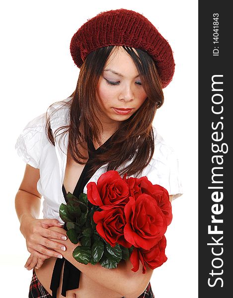 An beautiful young Asian girl kneeling in the studio in a black short dress and high heels, with a bunch of red roses in her arms, for white background. An beautiful young Asian girl kneeling in the studio in a black short dress and high heels, with a bunch of red roses in her arms, for white background.