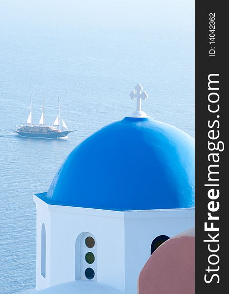 Greek church in santorini greece with a cross