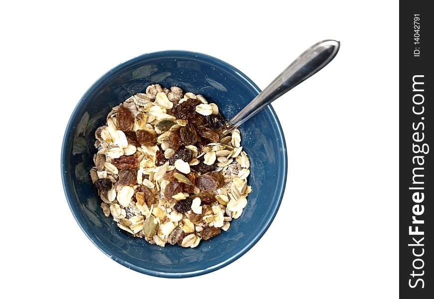 A bowl with muesli on white background and a spoon