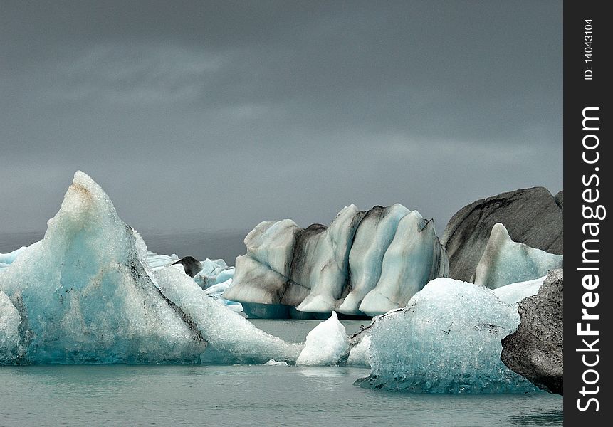 Jokulsarlon lake at Iceland. Icebergs on the surface. Jokulsarlon lake at Iceland. Icebergs on the surface.