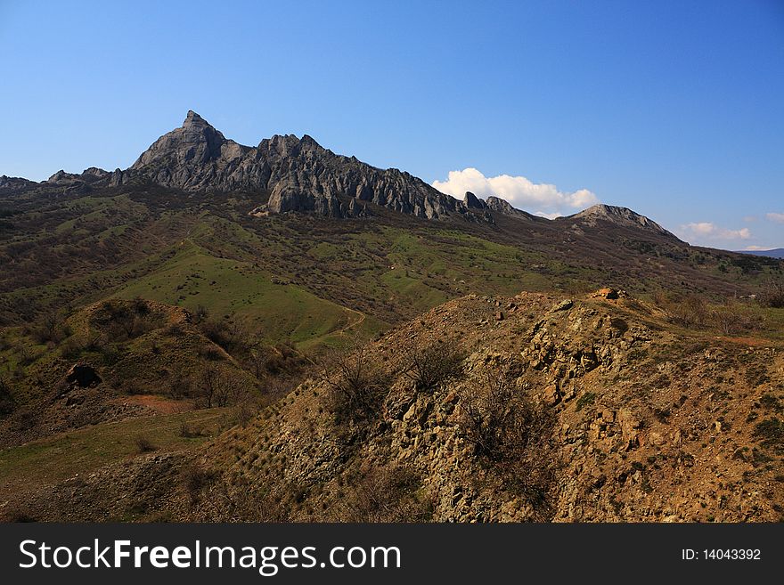 Mountain landscape with yellow and green grass. National park karadag