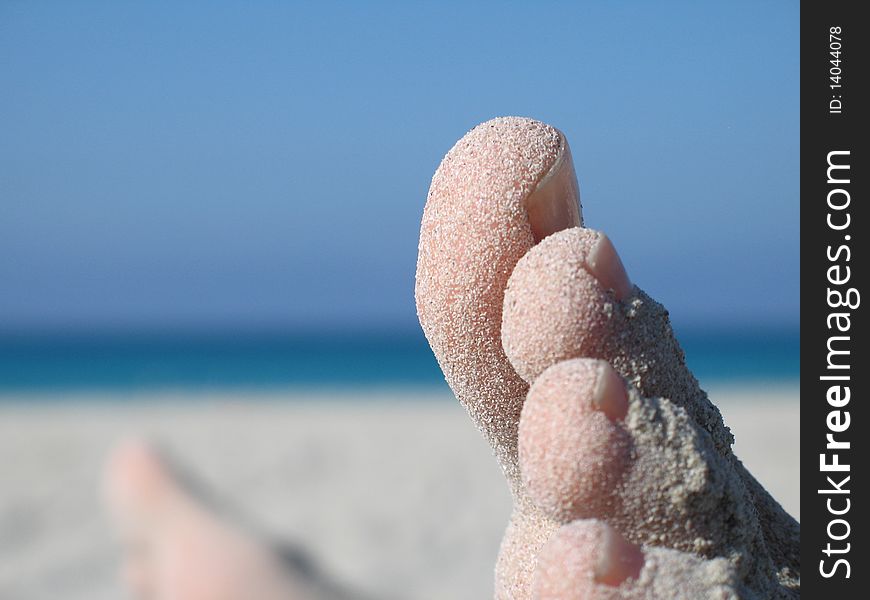 Close up of sandy feet