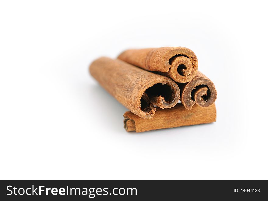 Delicious looking cinnamon sticks isolated on a white background. Delicious looking cinnamon sticks isolated on a white background