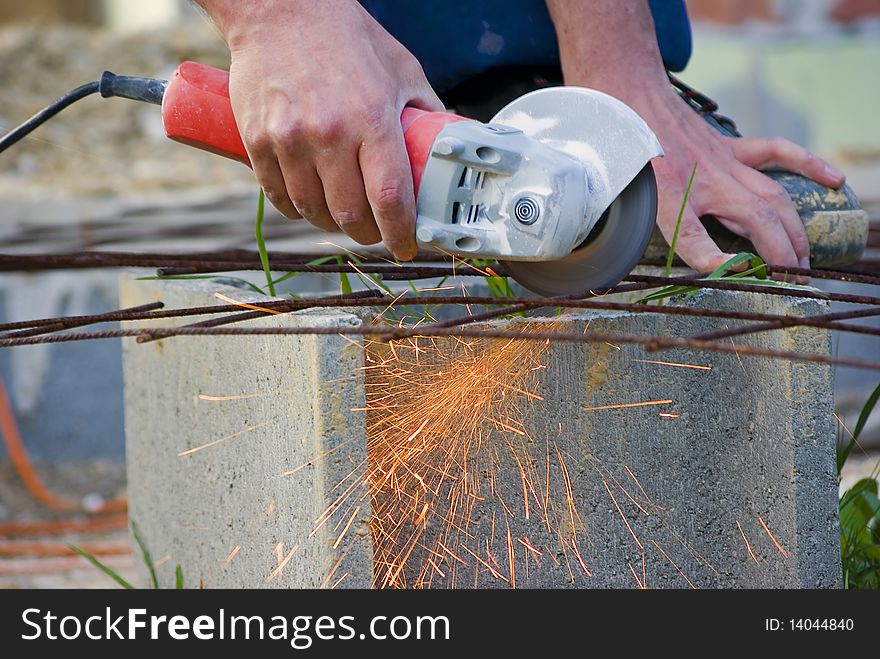 Man working with handtool on construction site. Man working with handtool on construction site