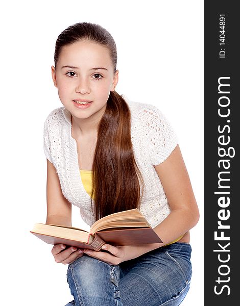 Girl reading book, isolated over white background