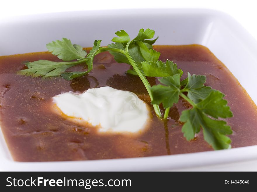 Borscht in white bowl isolated on white. Borscht in white bowl isolated on white