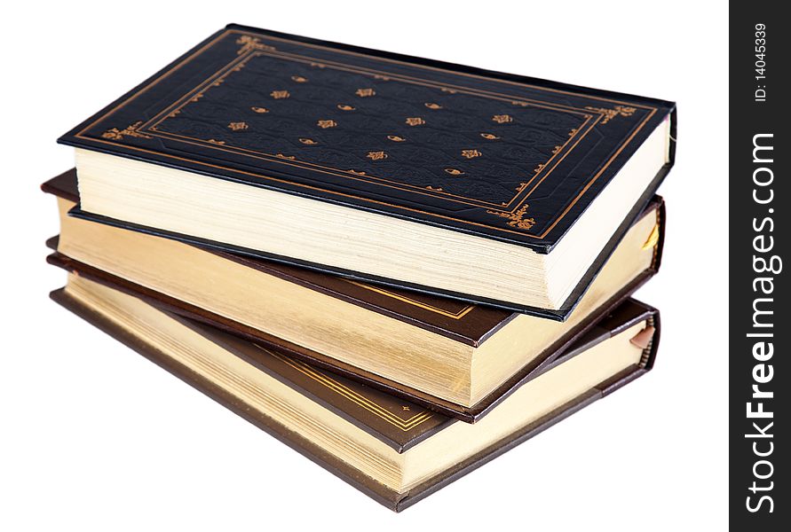 Stack of three vintage-style hardcover books, isolated on a white background. Stack of three vintage-style hardcover books, isolated on a white background.