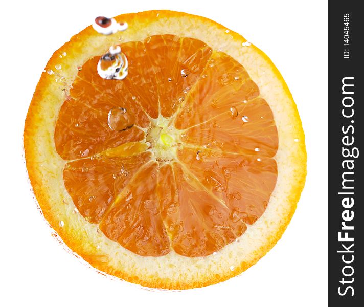 Half of an orange, splashed with clear water. Isolated on a white background. Half of an orange, splashed with clear water. Isolated on a white background.