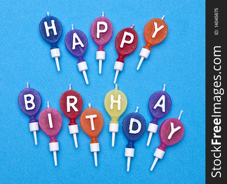 Happy Birthday Candles on Bright Blue Background. Happy Birthday Candles on Bright Blue Background.