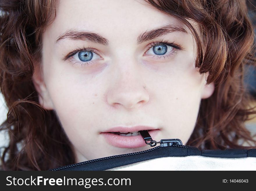 Portrait of young girl with a lock in the mouth. Portrait of young girl with a lock in the mouth