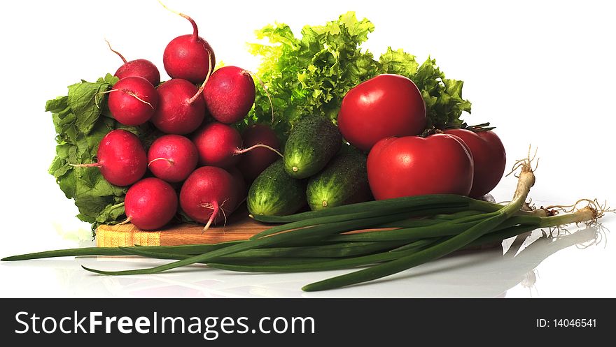 Vegetables in kitchen for salad on wooden hardboard, isolated on white. Vegetables in kitchen for salad on wooden hardboard, isolated on white