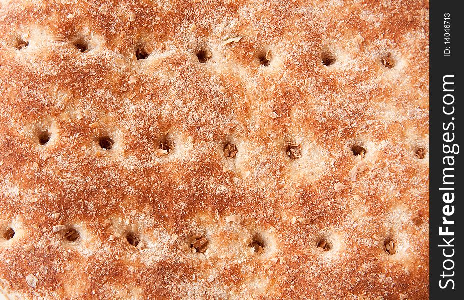 Closeup of top of bread bun, showing texture and holes in a horizontal pattern. Closeup of top of bread bun, showing texture and holes in a horizontal pattern