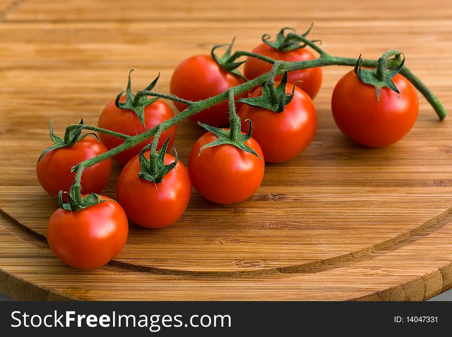 A Food Scene,close up shot,tomatoes on the vine .