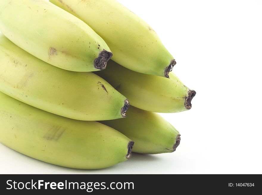 Not ripe banana on white background