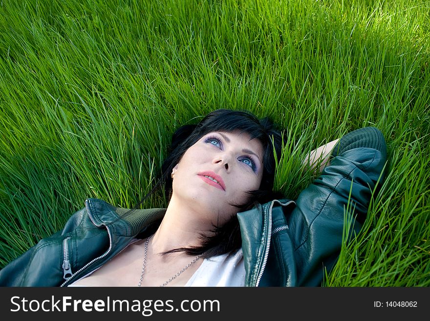 Young model laying in the grass. Young model laying in the grass