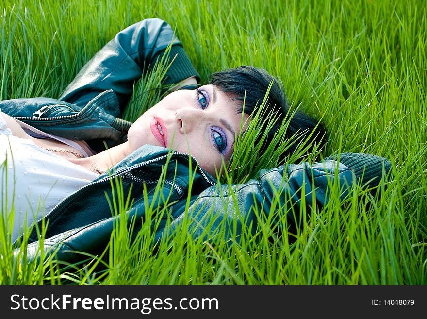 Young model laying in the grass. Young model laying in the grass