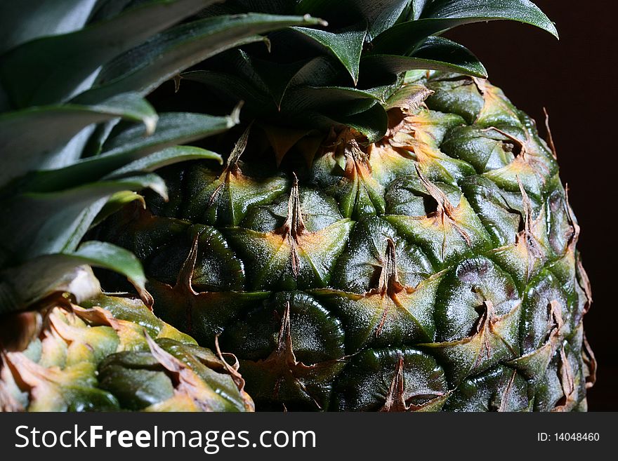 Pineapples from tropics a close up, a background black.