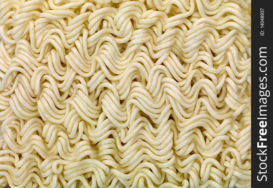 Dry instant noodles isolated against a blue background