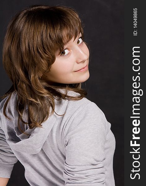 Portrait of teenage girl on a black background. Portrait of teenage girl on a black background