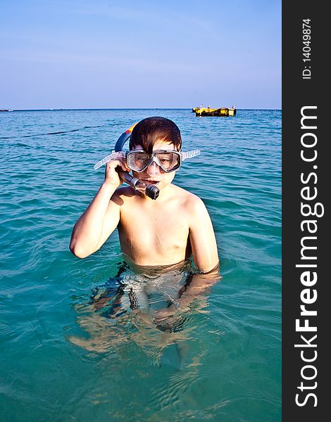 Young Boy Enjoying Snorkeling In The Sea