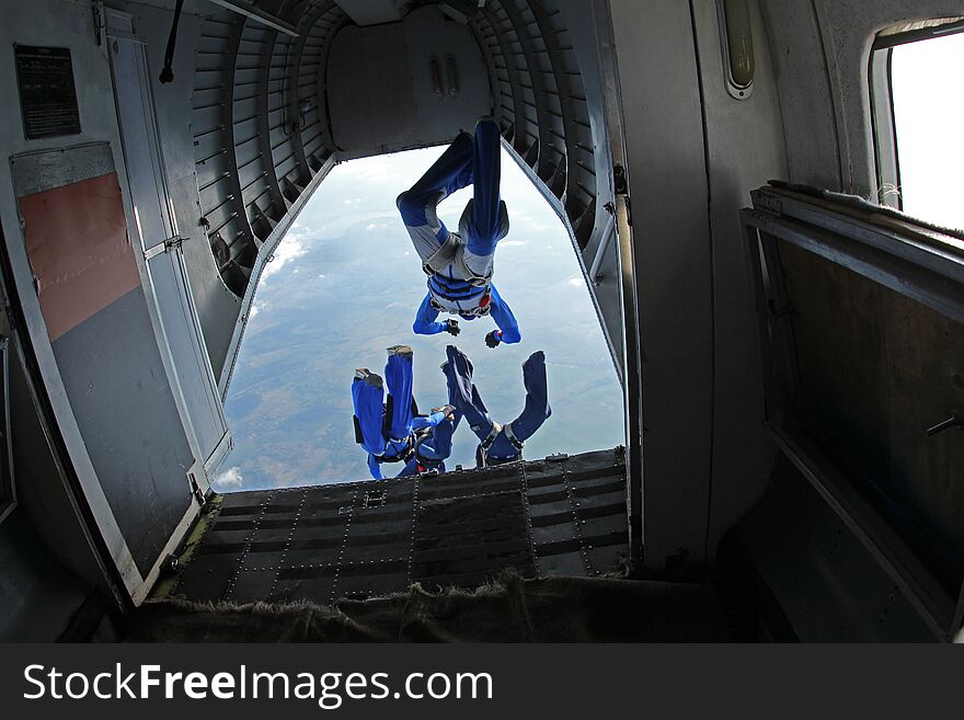 Skydiving. The view from an airplane. Skydivers are jumping out. Skydiving. The view from an airplane. Skydivers are jumping out.