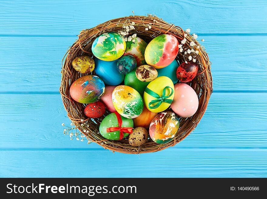 Table setting arrangement in minimal style with easter spring holiday attributes, fork, knife and napkin. Background, copy space, close up, flat lay, top view. Table setting arrangement in minimal style with easter spring holiday attributes, fork, knife and napkin. Background, copy space, close up, flat lay, top view