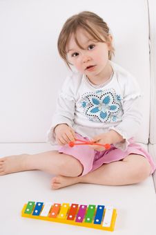 Little Girl With Instrument Stock Photo