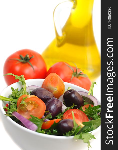 Salad with cherry tomatoes, onion and olives -white background