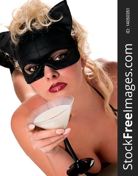 Blond model wearing black cat, drinking milk
