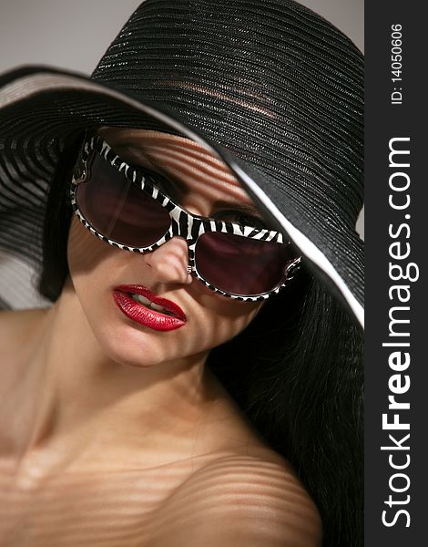 Model In Striped Hat And Sunglasses