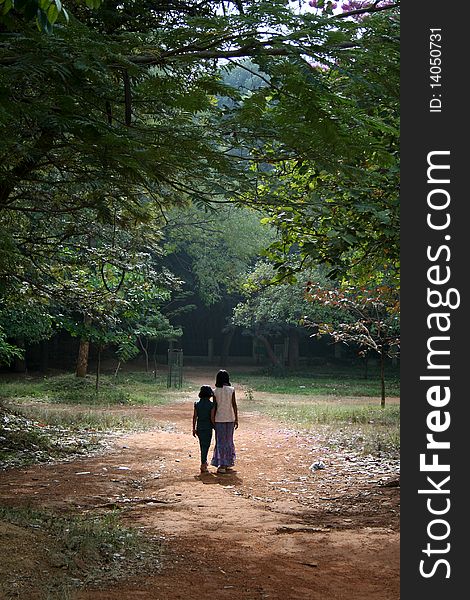 Two Indian girls having morning stroll in a park. Two Indian girls having morning stroll in a park