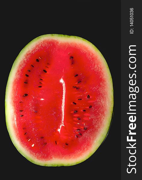 Big red watermelon isolated on black  background. Big red watermelon isolated on black  background