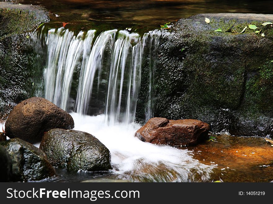 A small waterfall in the national city park. A small waterfall in the national city park.