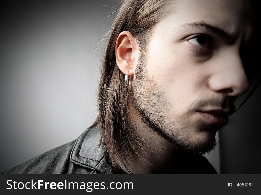 Young man wearing an earring