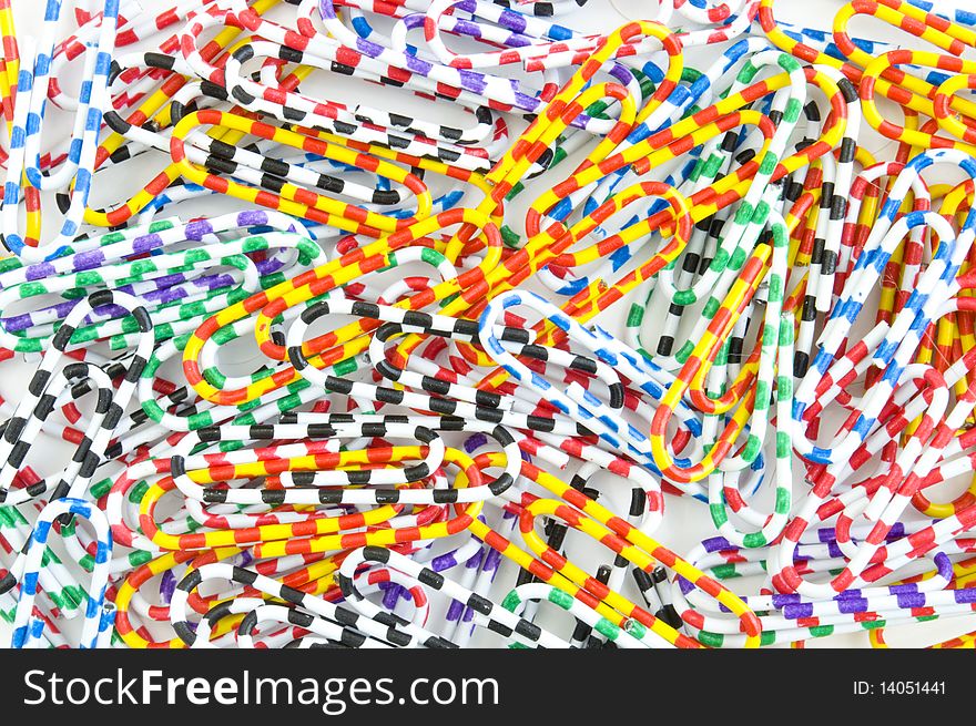 Colored paper clips on the entire background