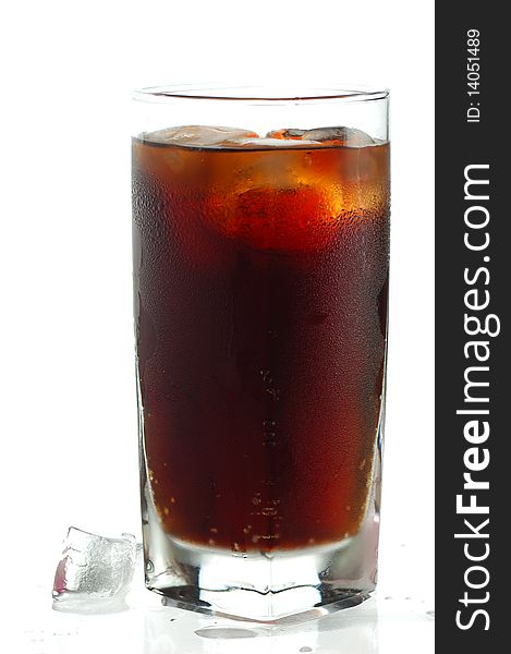 Glass of cola on a glass table