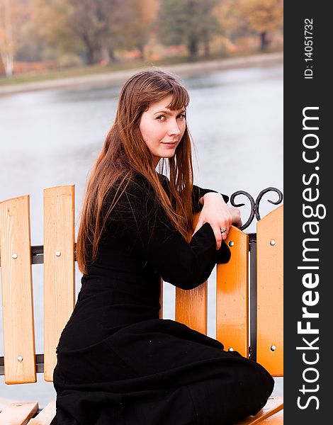 Portrait of  lady in black dress in the park