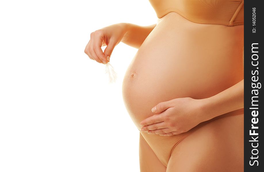 Pregnant woman holding white feather. Pregnant woman holding white feather