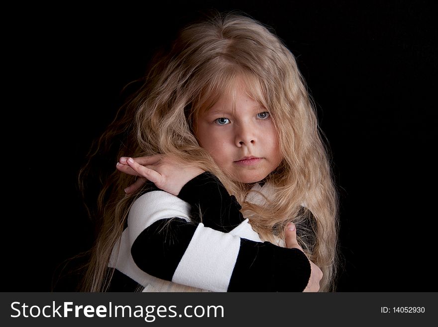 Beautiful little girl with long hair and refined manners. Beautiful little girl with long hair and refined manners